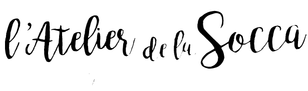Le logo typographique noir de l'Atelier de la Socca.